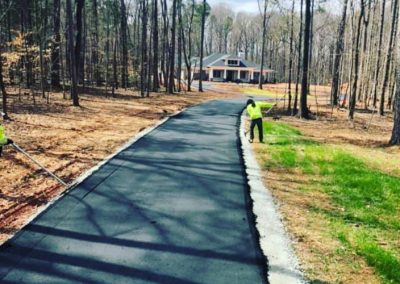 New asphalt driveway installation by SMI Paving crew