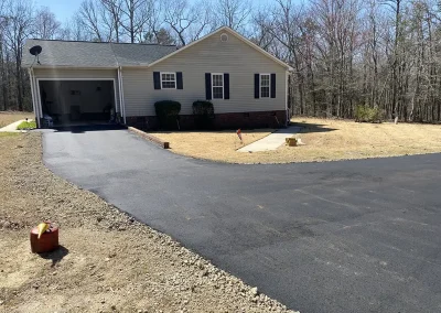 Completed asphalt driveway at a new home