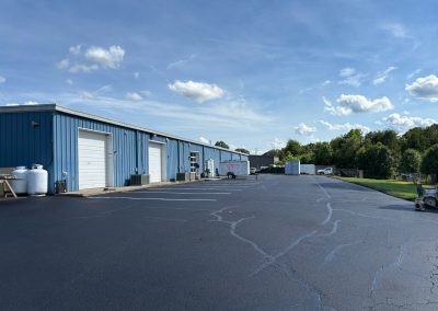 Commercial warehouse parking lot with repaired asphalt cracks