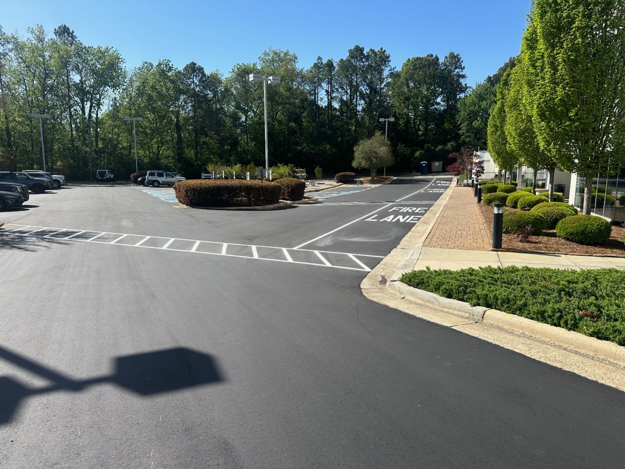 newly surfaced sealcoating and line striping for parking lot